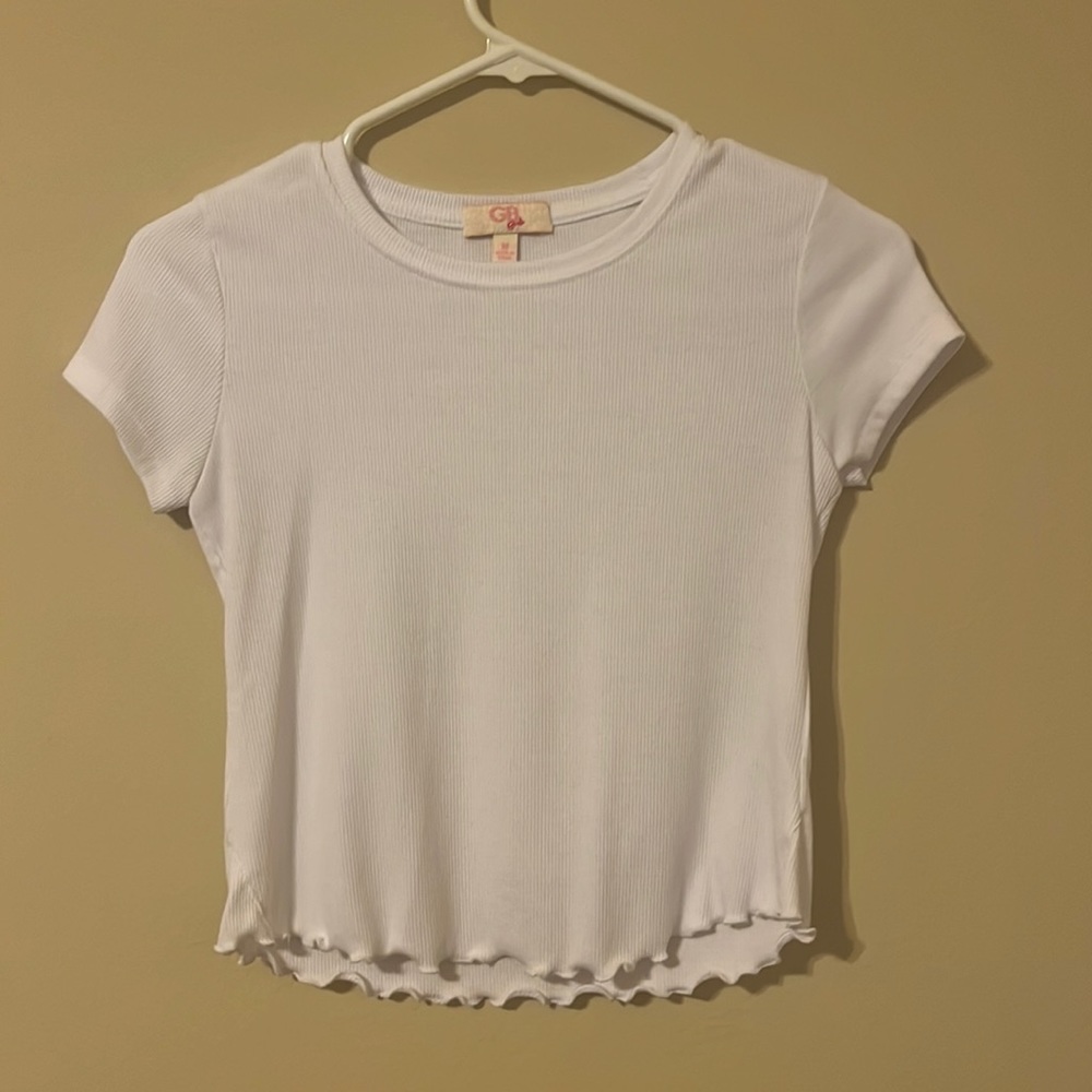 Girl’s cute white tee with ruffled detailing
